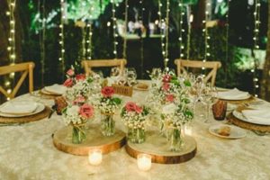centros de mesa con flores y velas
